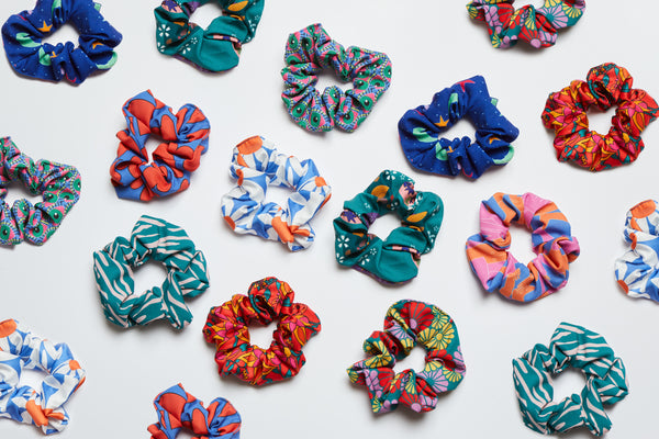flat lay of colourful and vibrant hair scrunchies 